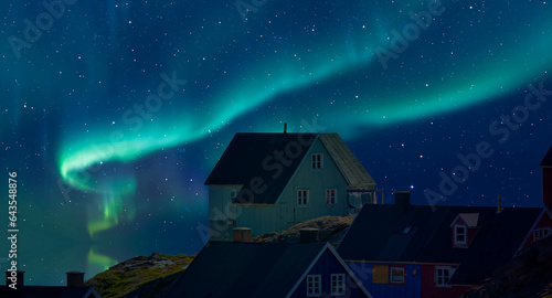 Picturesque village on coast of Greenland - Colorful houses in Tasiilaq with Aurora Borealis or Northern lights - East Greenland