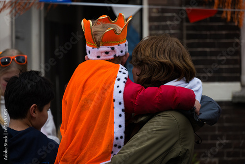Amsterdam, Netherlands - April 27 2023: Wearing classic Dutch orange for King's Day celebrations