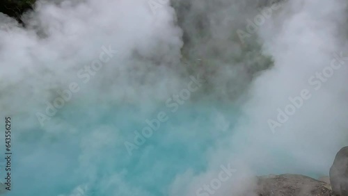 umi jigoku or sea hell taken in beppu with steamy hot springs geyser steaming off the cobalt water. steaming geyser. Taken in Beppu, Japan photo