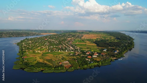 Drone's Lens Capturing the Picturesque Beauty of Nature's Embrace, over Majestic Dniester River and Molovata Village, Birds-eye View photo