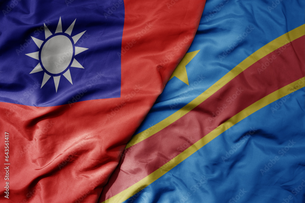 big waving national colorful flag of taiwan and national flag of democratic republic of the congo .