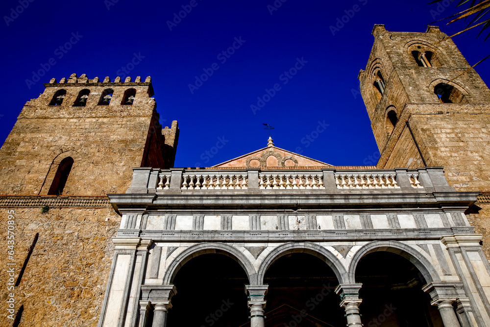 Santa Maria Nuova cathedral, Monreale, Sicily, Italy. Portal and Norman towers.