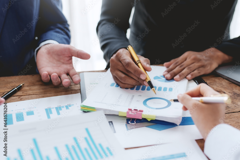 Business people meeting explaining the financial graph data and marketing plan. Business people meeting explaining the financial graph data and marketing plan.