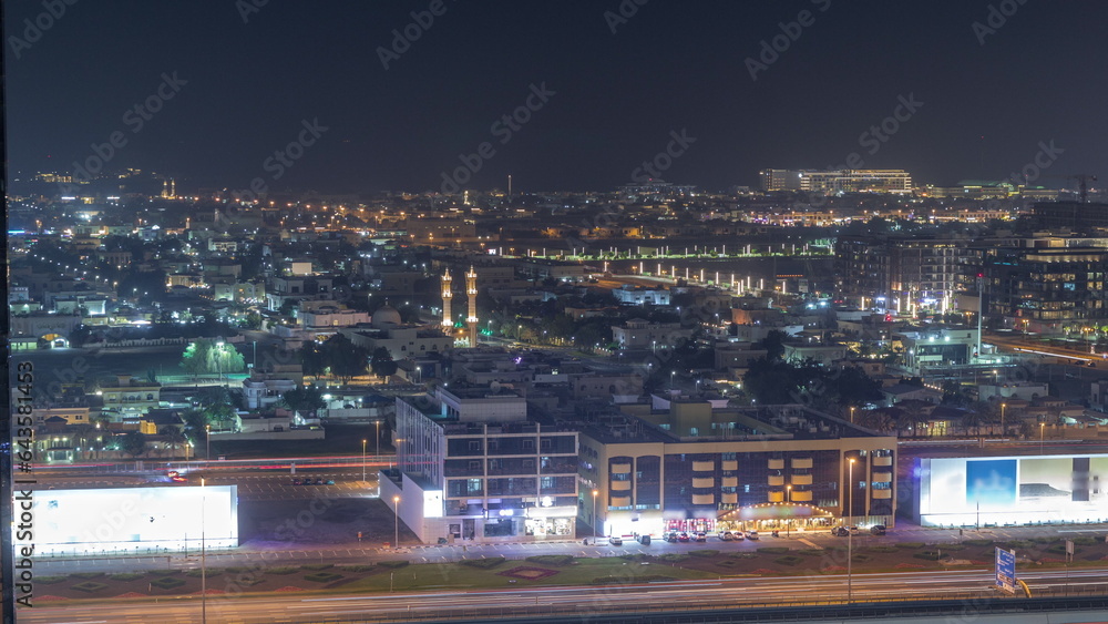 Obraz premium Aerial view to Dubai City Walk district night timelapse from above