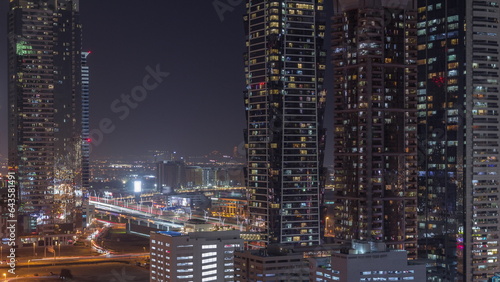 Business bay district skyline with modern architecture night timelapse from above. © neiezhmakov