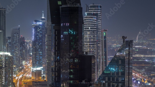 High-rise buildings on Sheikh Zayed Road in Dubai aerial night timelapse, UAE. photo