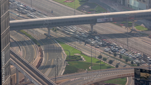 Aerial view from above to a busy road intersection in Dubai timelapse.