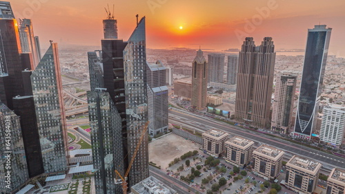Photography High-rise buildings on Sheikh Zayed Road in Dubai aerial timelapse during sunset, UAE