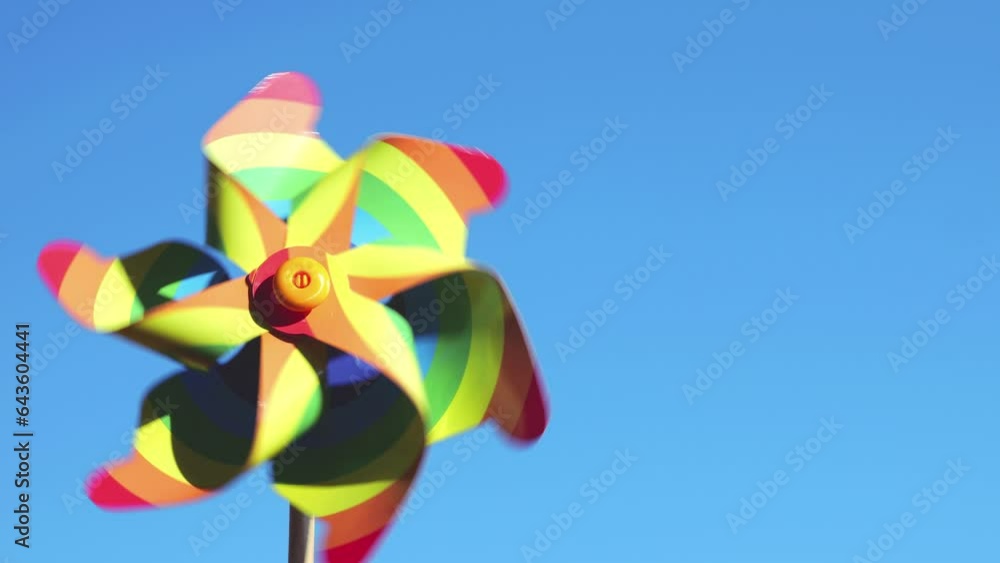 Pinwheel colors of the rainbow on the background of the sky. LGBT colors concept. Pinwheel colors of the rainbow on the background of the sky. LGBT colors concept.
