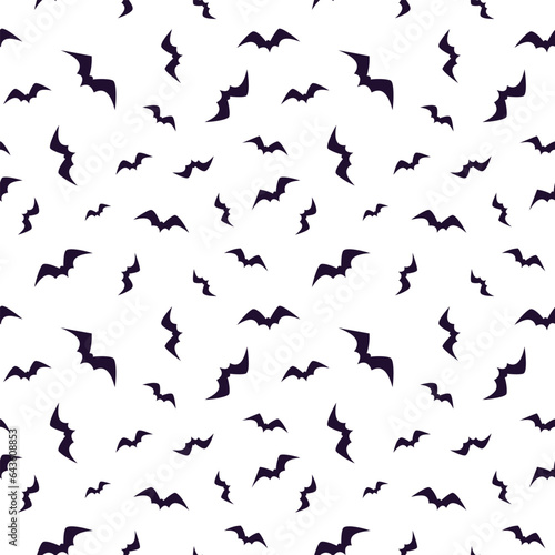 Seamless pattern with flying bats. Isolated on a white background. Design for decoration on Halloween © Alex_Zakharov