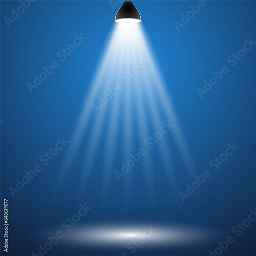 transparent rays of light from an electric lamp on a blue background. Light beam.