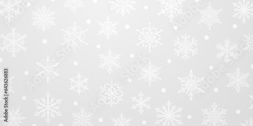 Christmas background of beautiful complex snowflakes in gray colors. Winter illustration with falling snow