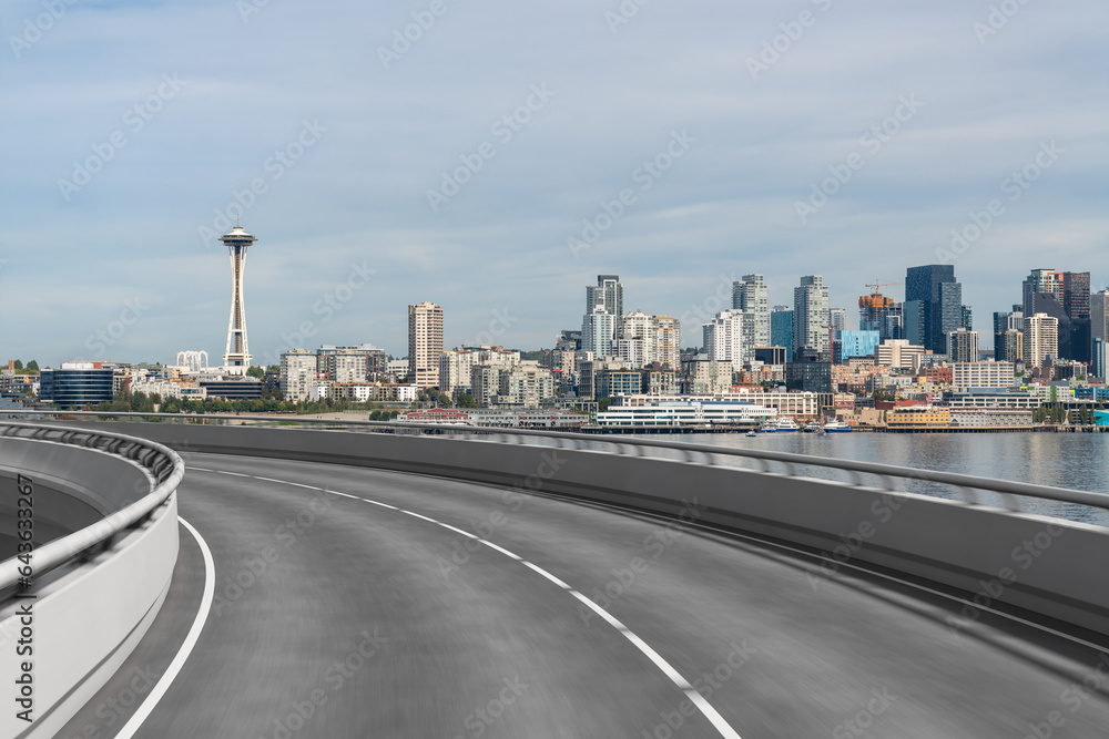 Empty urban asphalt road exterior with city buildings background. New modern highway concrete construction. Concept way to success. Transportation logistic industry fast delivery. Seattle. USA.