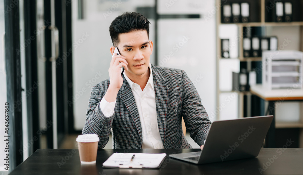 © Nuttapong punna - Mature business man executive manager looking at laptop watching online webinar training or having virtual meeting video conference doing market research working in office..