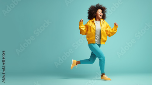 Full length body size view of attractive carefree girl dancing isolated over blue background