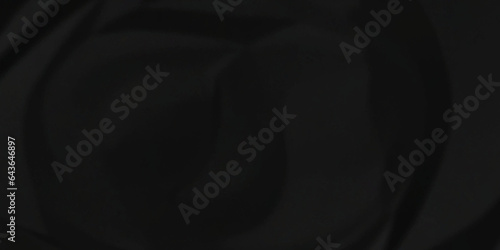 Crumpled paper texture dark black crumpled paper texture crush paper so that it becomes creased and wrinkled. Old black crumpled paper sheet background texture.	
