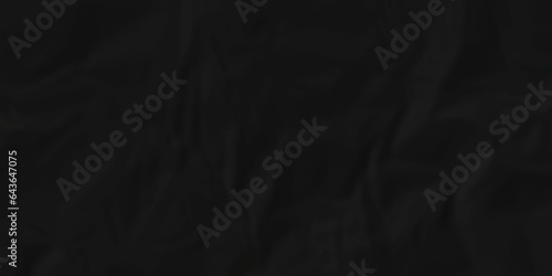 Crumpled paper texture dark black crumpled paper texture crush paper so that it becomes creased and wrinkled. Old black crumpled paper sheet background texture.	