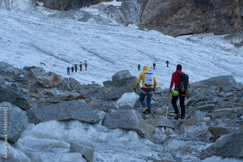 Mountaineers climbing Gran Paradiso glacier to the summit of the mountain. Gran Paradiso National Park, Italian Alps.