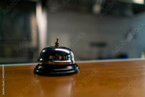 a call on the background of a professional kitchen for the cook, which is pressed when the dish is ready to notify the waiter