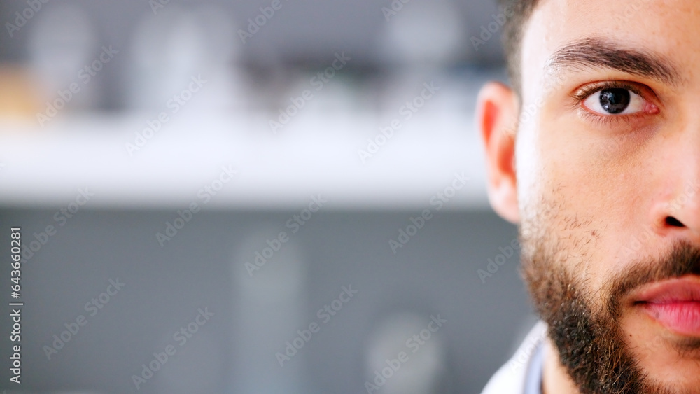 Naklejka premium Face of serious young male in a high stress environment. Closeup of a business man head with a beard feeling anxious and stressed about work. Nervous office employee worried and looking forward.