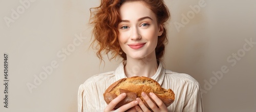 Woman holding bread on a br...