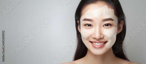 Smiling Asian woman with di...