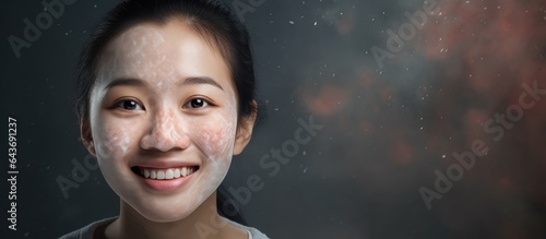 Smiling Asian woman with di...