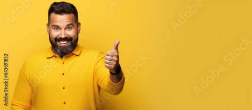 Hispanic man confidently po...