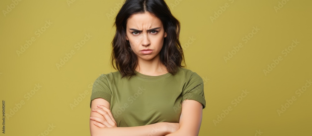 Unhappy young woman in casual clothes expressing dislike Unhappy young woman in casual clothes expressing dislike