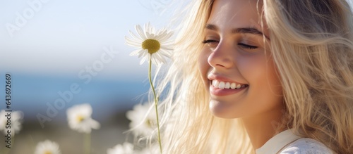 Young blond woman with blue...