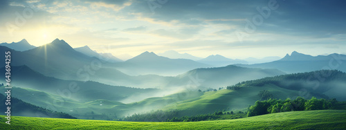 High definition blurry landscape with mountain on green grass at sunrise for background, backdrop