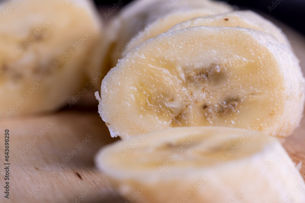 Sliced ripe banana on a cutting board Sliced ripe banana on a cutting board