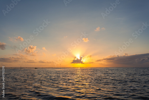 .Beautiful golden reflection sunrise above the lagoon..landscape Amazing yellow light of nature cloudscape sky background..Scene of romantic sky sun shine throughthe cloud. . photo