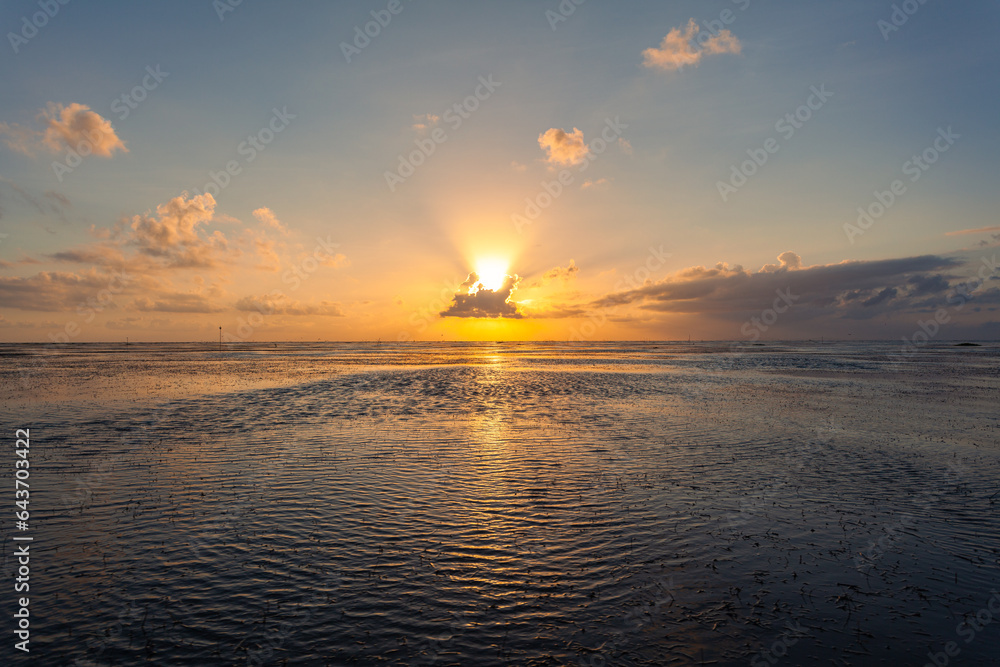 .Beautiful golden reflection sunrise above the lagoon..landscape Amazing yellow light of nature cloudscape sky background..Scene of romantic sky sun shine throughthe cloud. .
