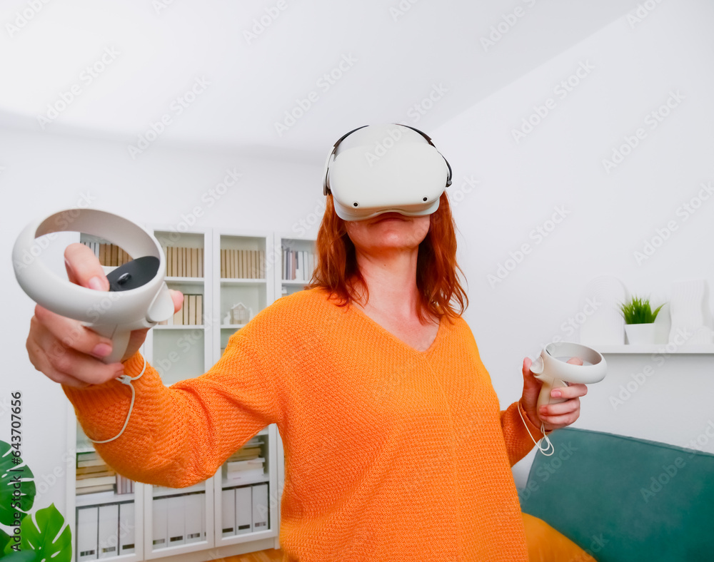 woman playing VR glasses. Sport in virtual reality. The concept of metaverse, virtual reality, future, technology and internet of things.