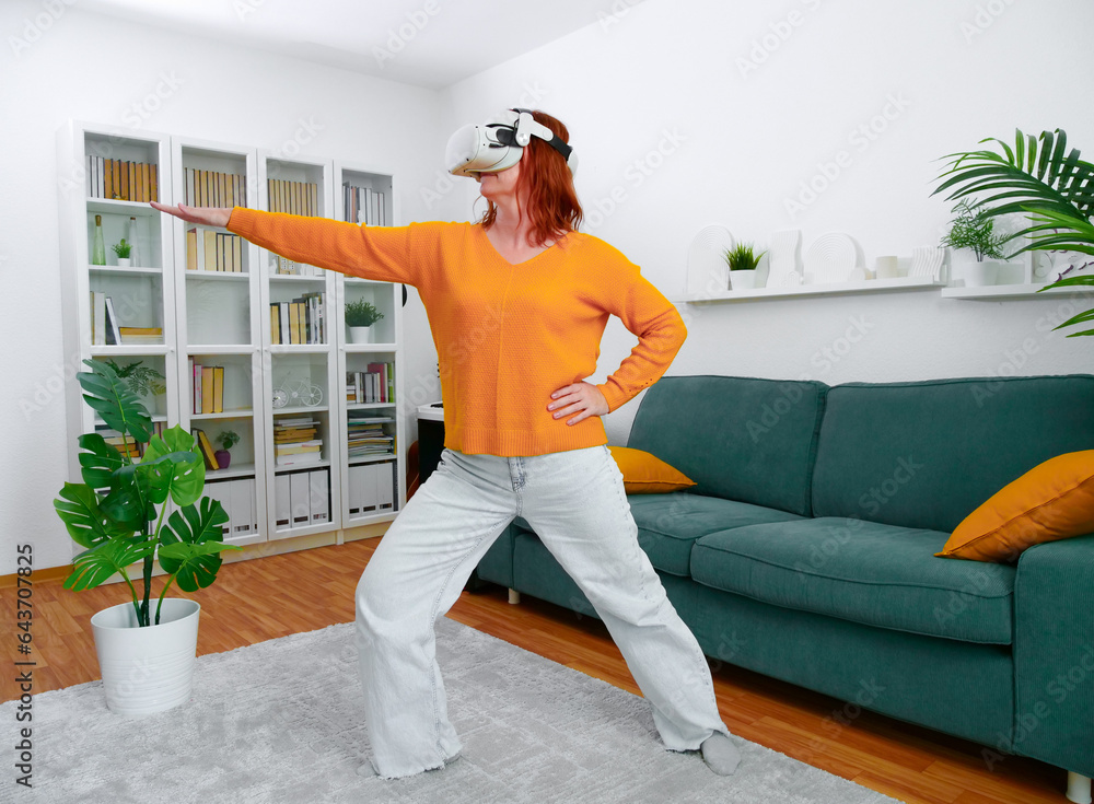 woman playing VR glasses. Sport in virtual reality. The concept of metaverse, virtual reality, future, technology and internet of things.