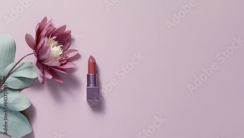 Composition of mauve lipstick and flowers for advertising cosmetic products, soft gradient background