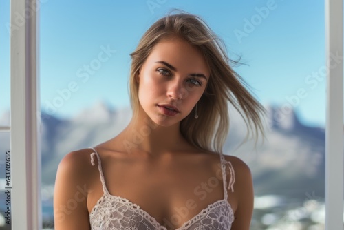 Close-up portrait photography of a blissful girl in his 30s wearing a lace bralette at the table mountain in cape town south africa. With generative AI technology