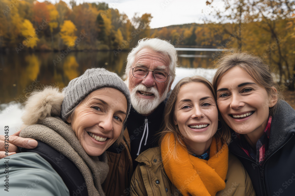 Family senior taking selfie on lake shore Family senior taking selfie on lake shore