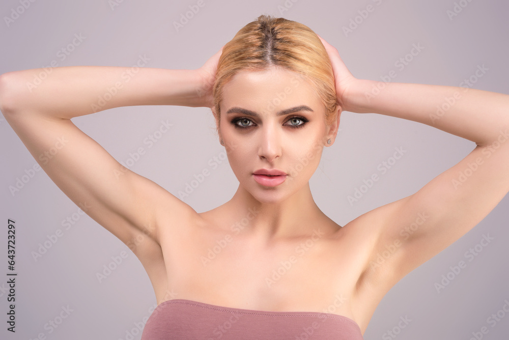 Fashion beauty portrait of young woman with natural makeup and perfect clean skin. Sexy model posing in studio. Girl with trendy hairstyle. Beautiful woman face close up. Fashion beauty portrait of young woman with natural makeup and perfect clean skin. Sexy model posing in studio. Girl with trendy hairstyle. Beautiful woman face close up.