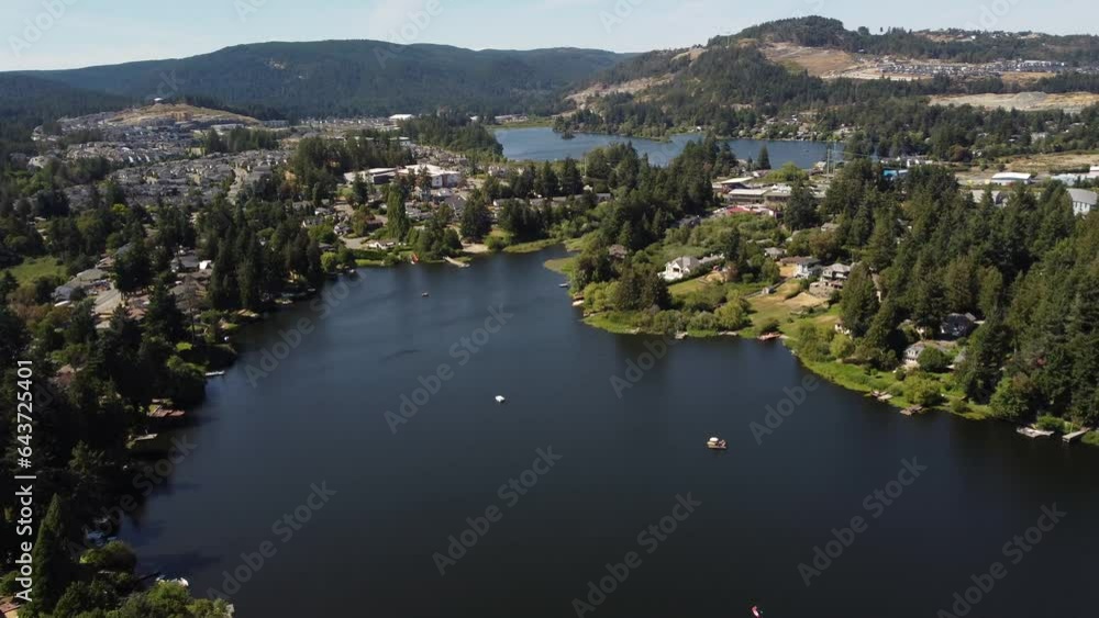 Aerial Glen Lake and Langford Lake parallax shot overlooking distant development near Bear Mountain in Victoria BC Canada.
Aerial Glen Lake and Langford Lake parallax shot overlooking distant development near Bear Mountain in Victoria BC Canada.