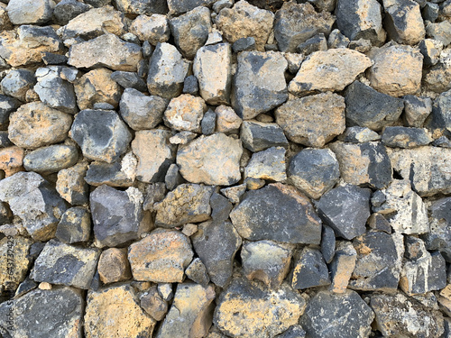 wall of large gray stones close-up, background, texture