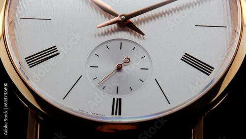 Stylish Luxury Man Wrist Watch With Moving Hand And Multiple Dials. Men's watch in metal with sapphire crystal. Closeup view of rotating watch, running second arrow. Cyclops watch