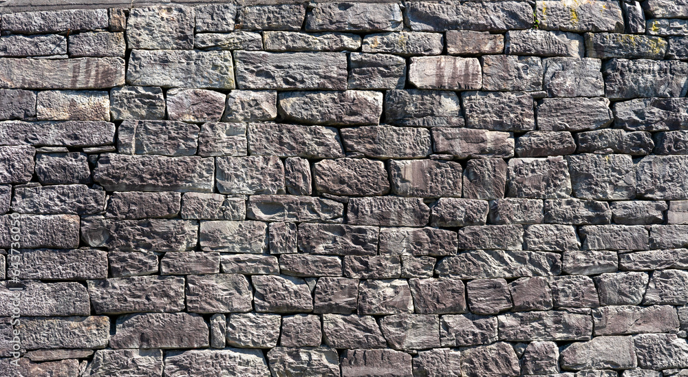 old stone wall with gray stones old stone wall with gray stones