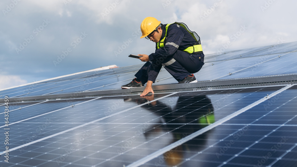 Service engineer checking solar cell on the roof for maintenance if there is a damaged part. Engineer worker install solar panel. Clean energy concept. Service engineer checking solar cell on the roof for maintenance if there is a damaged part. Engineer worker install solar panel. Clean energy concept.