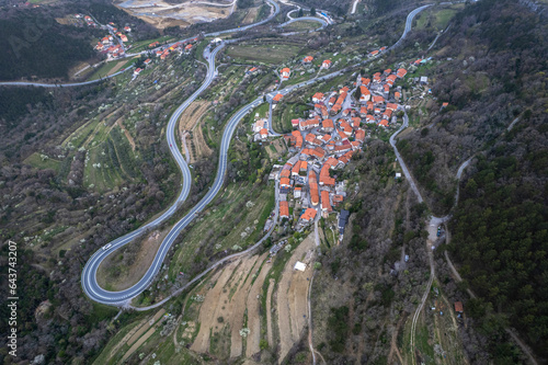 Aerial view of the village Crni Kal and old winding road, Slovenia photo