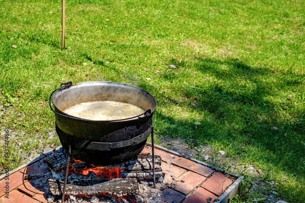 Romanian traditional food prepared at the cauldron on the open fire Romanian traditional food prepared at the cauldron on the open fire