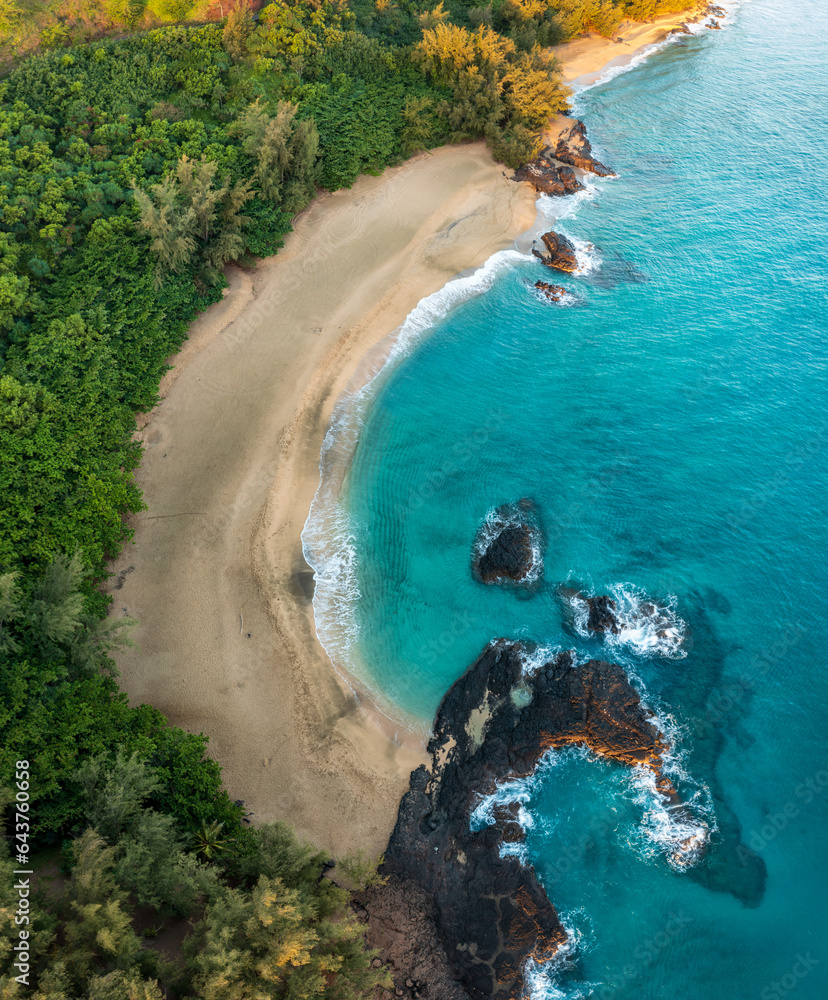 Φωτογραφία Aerial drone view of the rocks and waves at the end of Lumaha'i beach on north c