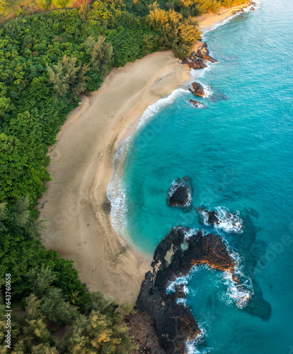 Aerial drone view of the rocks and waves at the end of Lumaha'i beach on north coast of Kauai in Hawaii