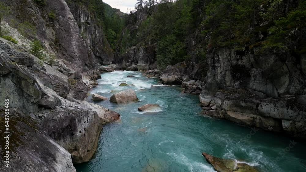River in a Rocky Mountain Canyon. British Columbia, Canada. Aerial Nature Background. Cinematic River in a Rocky Mountain Canyon. British Columbia, Canada. Aerial Nature Background. Cinematic